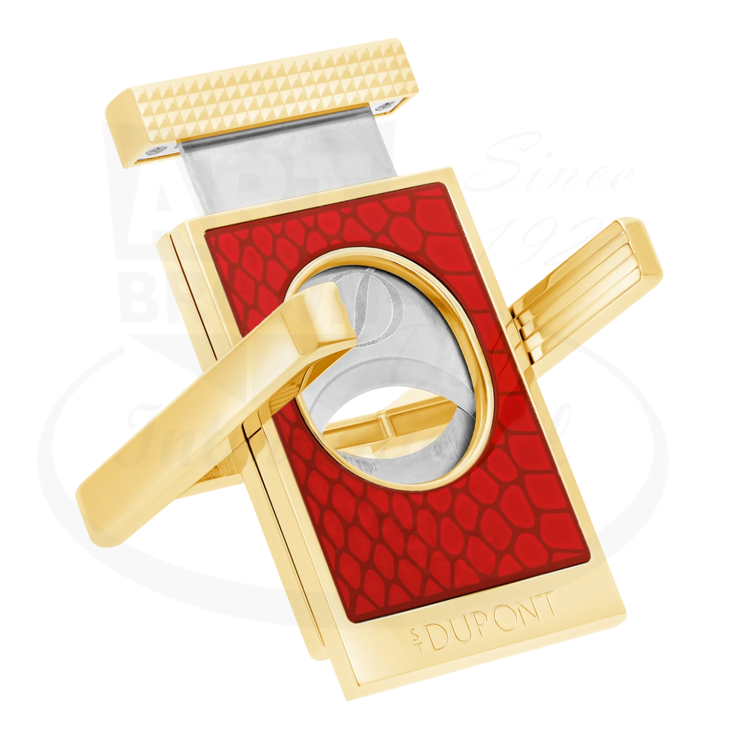 S.T. Dupont cigar cutter & stand with Snake scale motif on red lacquer, with stand opened.