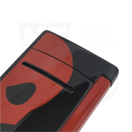 Close-up of S.T. Dupont Minijet black lighter with red skull design, 010062.