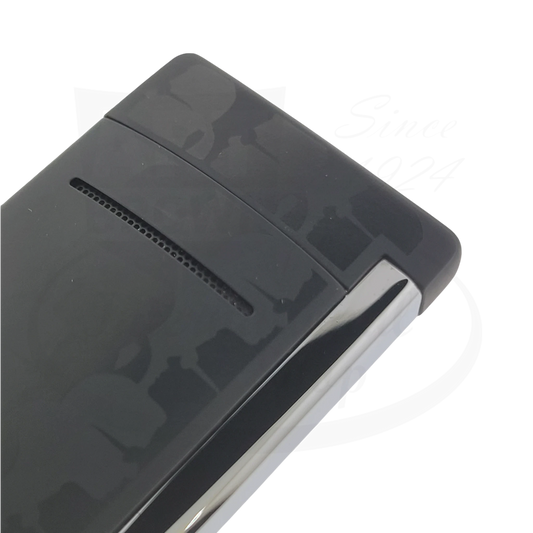 Angled view of S.T. Dupont Minijet Karl Lagerfeld Black lighter showing silhouette pattern, model 010069.