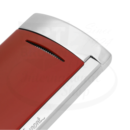 Corner of S.T. Dupont Minijet torch lighter with brilliant red lacquer and chrome finish