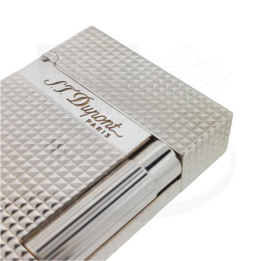 Close up of detailed guilloche on S.T. Dupont Ligne 2 Diamond Head Palladium lighter, showing Dupont engraving.