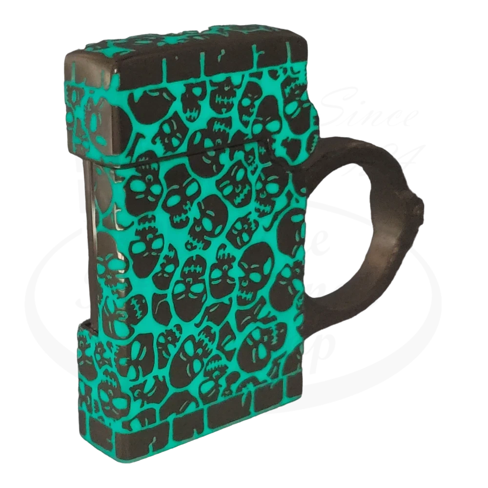 S.T. Dupont Haute Creation tattoo spinner lighter with a black and green glow-in-the-dark skull pattern and a distinctive ring handle.