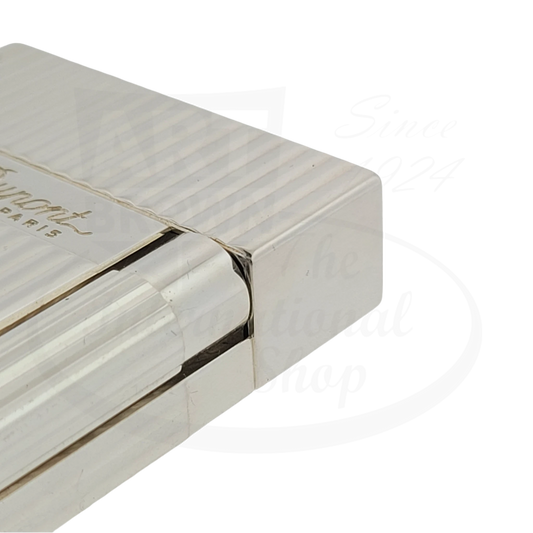 S.T. Dupont Ligne 2 016817-D2 silver-plated brass lighter featuring vertical line pattern texture, side view showing sleek metallic finish and distinctive corner design