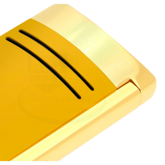 Close up of detailed finish on S.T. Dupont Maxijet torch lighter in honey yellow with gold accents.