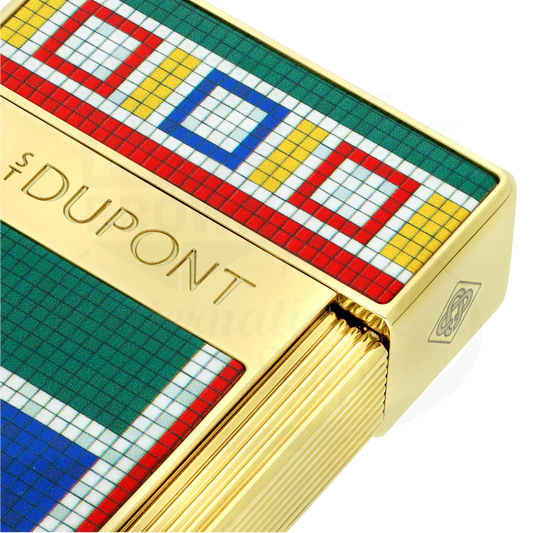 Closeup of S.T. Dupont x Casablanca gold biggy torch lighter, showcasing S.T. Dupont branding and detail of multicolored mosaic motif.