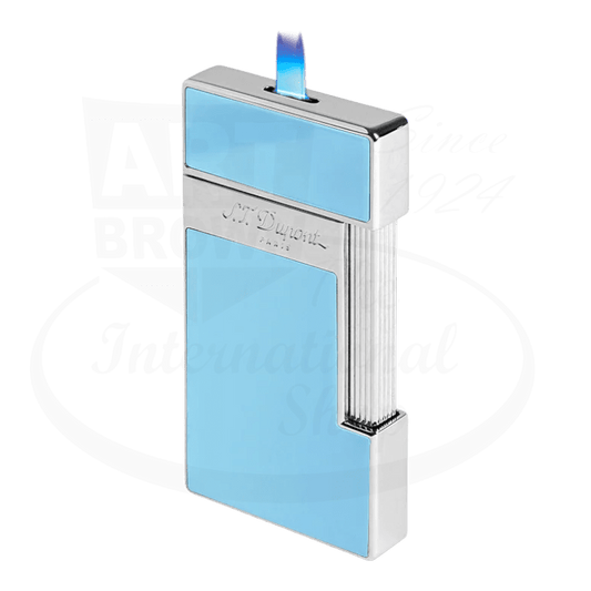 S.T. Dupont slimmy torch lighter ignited with light blue lacquer and chrome accents seen from the side