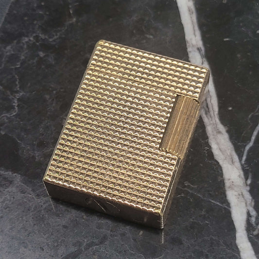S.T. Dupont Ligne 1 BS 012110-D3 gold metal vintage lighter with diamond head pattern and signs of wear on base