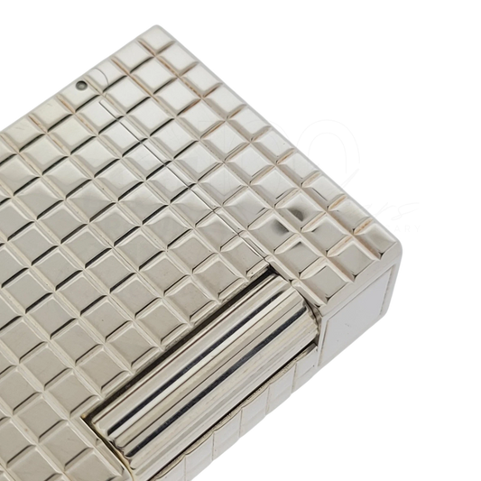 Close up of square grid guilloche on preowned S.T. Dupont line 1 lighter with silver finish.