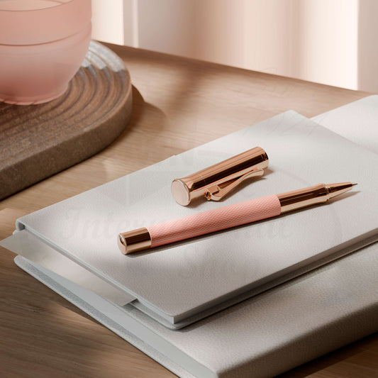 Graf von Faber-Castell Guilloche Rose Gold rollerball pen with pink resin barrel and engraved guilloché pattern
