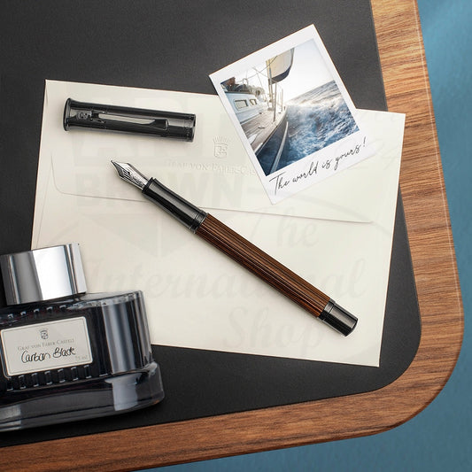 Graf von Faber-Castell Classic Macassar Fountain Pen wooden barrel with black metal trim and silver nib on letter paper