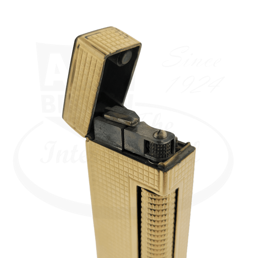 Dunhill Rollagas vintage lighter in 14K gold jacket featuring hobnail guilloche pattern, flip-top design with black interior mechanism