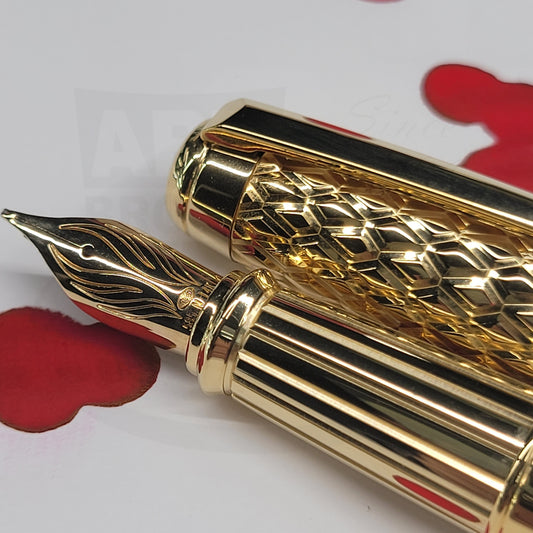 S.T. Dupont Dragon Guilloche red fountain pen, opened showing detail on cap and 14k nib.