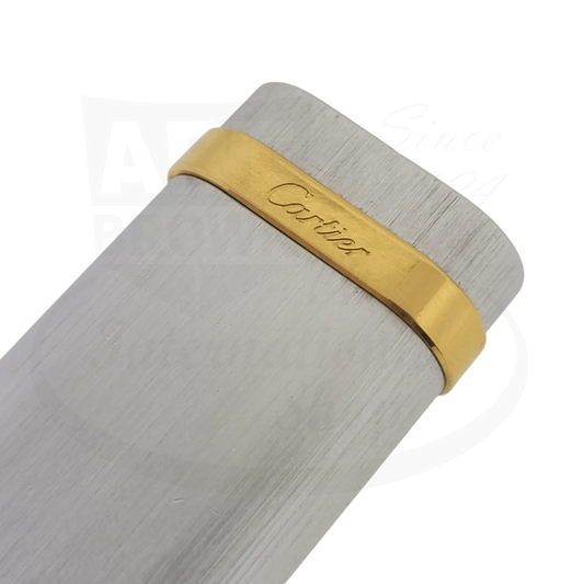 Cartier Duotone-4 lighter in brushed stainless steel with gold-tone band, featuring engraved Cartier signature on metallic trim