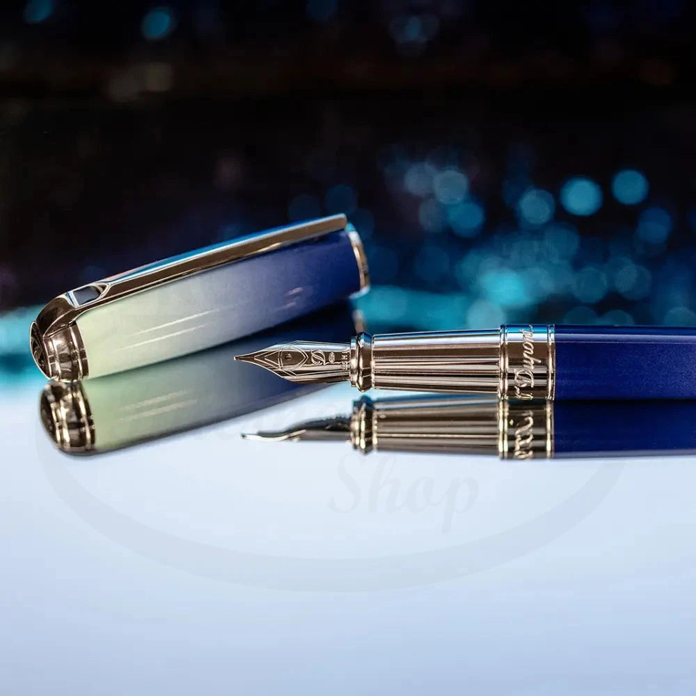 S.T. Dupont Line D Large La Mer Blue Lacquer & Palladium Fountain Pen with 14K gold nib and blue gradient lacquer finish.