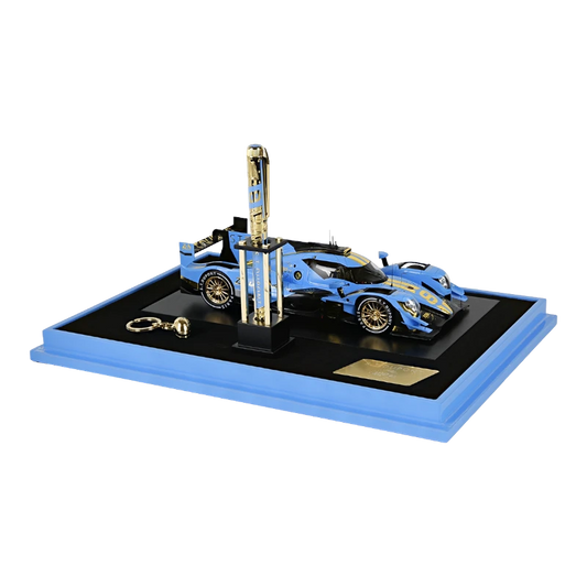 Luxury blue racing car model with a matching pen displayed on a sleek black and blue base collection set