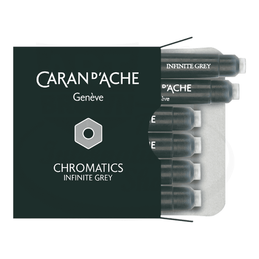 Caran D'Ache Chromatics Infinite Grey fountain pen ink cartridges in 6-pack configuration, displayed in dark green packaging with silver accents