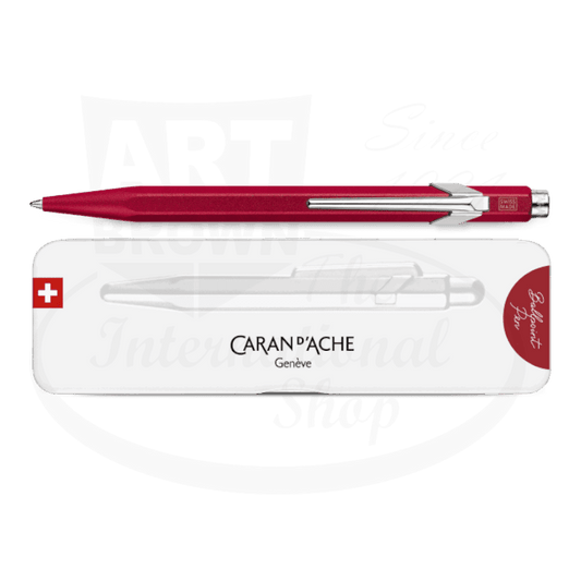 Caran D'Ache 849 Colormat-X metal ballpoint pen in vibrant red with chrome clip, shown with white Swiss-made storage case