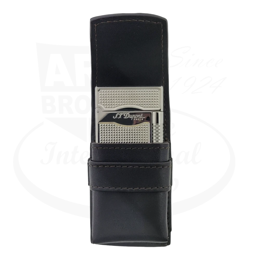 S.T. Dupont luxury lighter in sleek black leather case with silver-toned textured design, featuring premium holder with protective strap for elegant cigar accessories