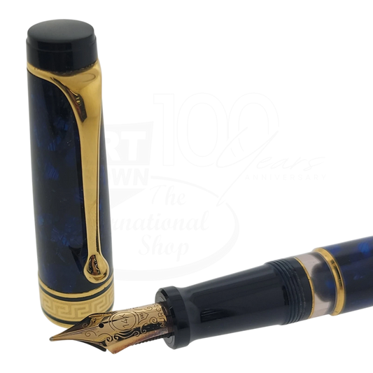 Aurora Optima fountain pen in blue Auroloide resin with 14K gold nib and gold trim, cap removed beside nib section