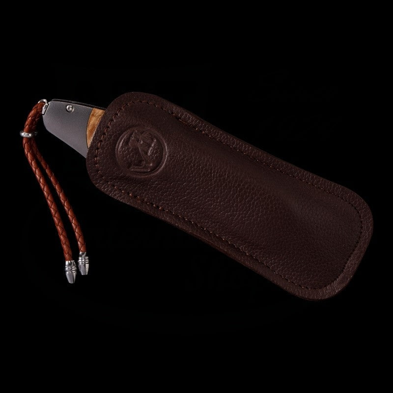 William Henry Spearpoint Fire and Ice brown leather sheath with braided leather lanyard, embossed logo, metal-tipped cord ends