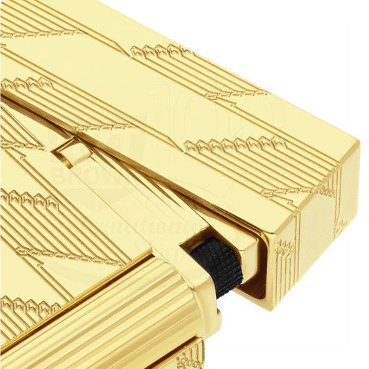Close-up of a luxury gold guilloche cigar lighter with intricate geometric patterns and sleek design details.