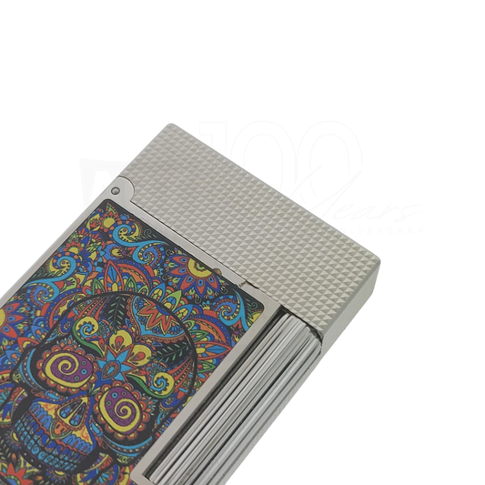 S.T. Dupont Ligne 2 C16393-D1 silver microdiamond lighter with colorful Mexican skull design soft flame close-up view
