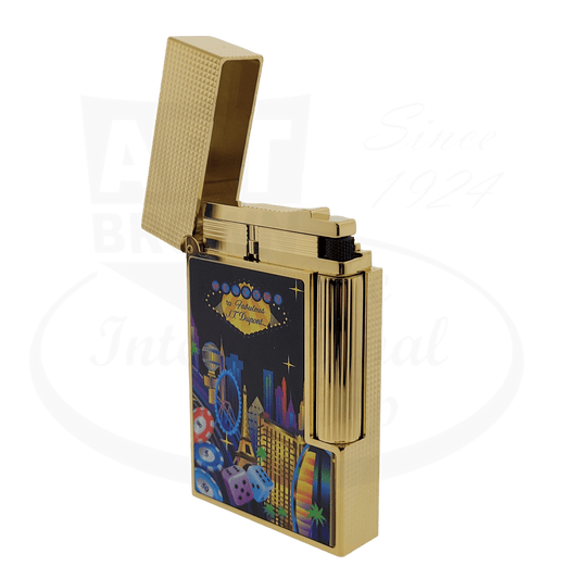 S.T. Dupont Ligne 2 C16396 brass lighter in gold finish with Las Vegas-themed lacquer design, featuring cityscape, dice and micro diamond head engraving