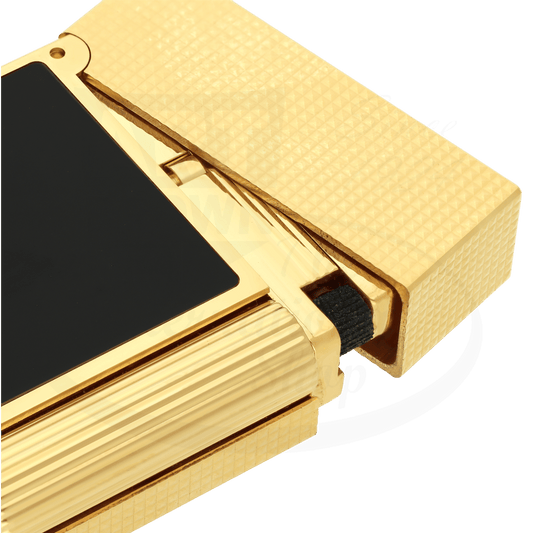 Corner of S.T. Dupont Ligne 2 perfect ping lighter with matte black lacquer and gold diamond head guilloche.