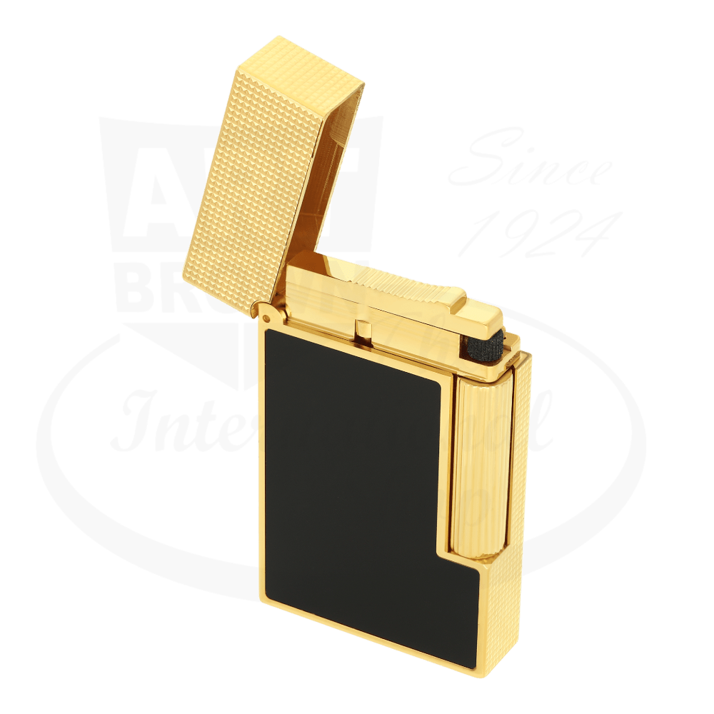 S.T. Dupont Ligne 2 perfect ping lighter with matte black lacquer and gold diamond head guilloche with lid opened.