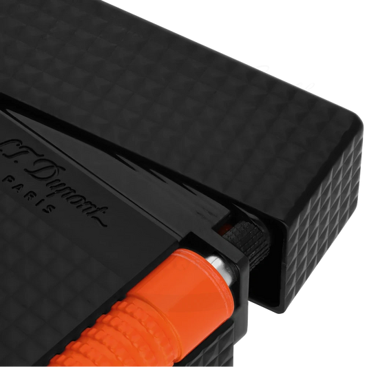 S.T. Dupont Le Grand C23069 metal lighter in matte black lacquer with diamond guilloche pattern and orange fluo trigger, featuring dual-flame system