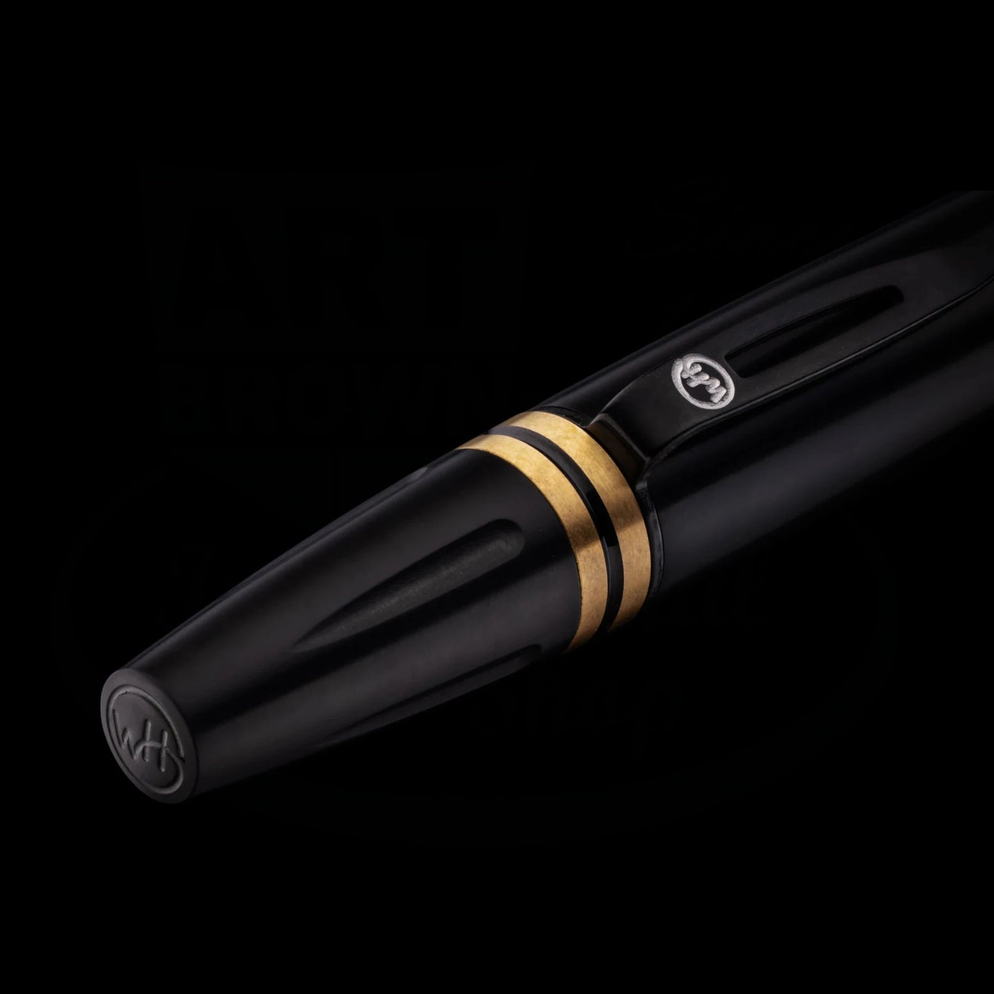 William Henry Caribe 11 titanium ballpoint pen in black with brass accent rings and art deco-inspired stainless steel trim and signature twist mechanism