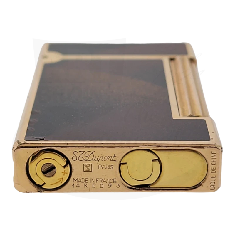 S.T. Dupont D-Line vintage lighter, orange lacquer with gold dust finish, brass body, featuring classic dual adjustment wheels and Made in France marking