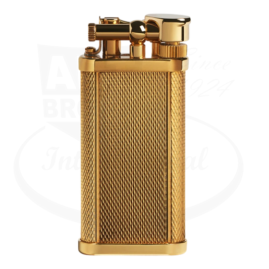 Dunhill Unique Gold Barley Grain brass lighter with textured diagonal pattern, PVD-plated finish, flint wheel mechanism, rectangular shape