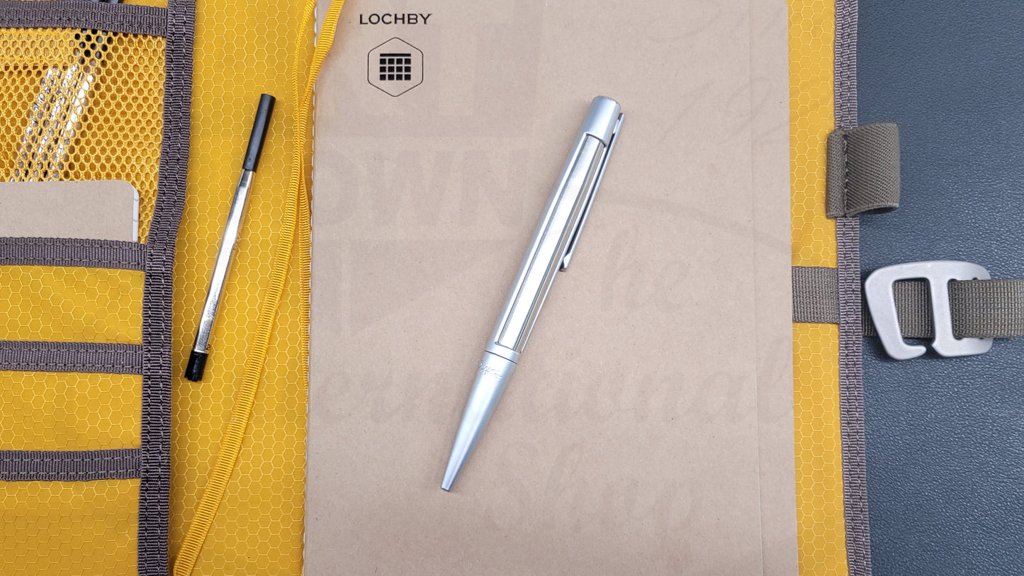 S.T. Dupont Defi Ballpoint pen with brushed chrome design and chrome finish, with stationary journal