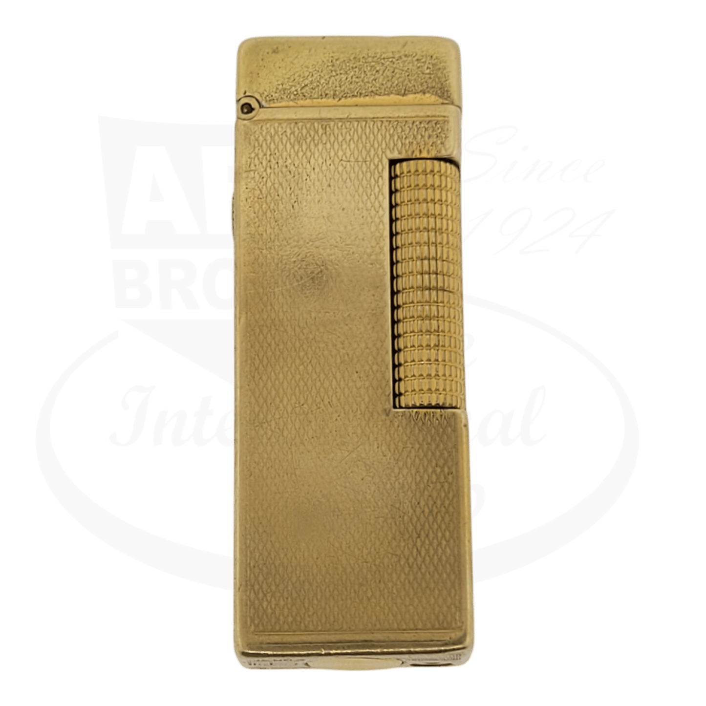Gold plated Dunhill Anomalies lighter with Barley grain pattern, seen from the front. Visible discoloration from age.