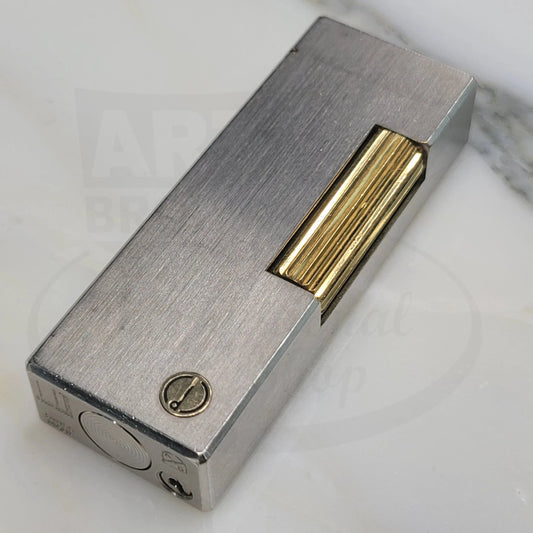 Preowned Dunhill Rollagas Dunhill-16 brushed palladium lighter with gold fluted ignition roller, Swiss-made collector’s piece.