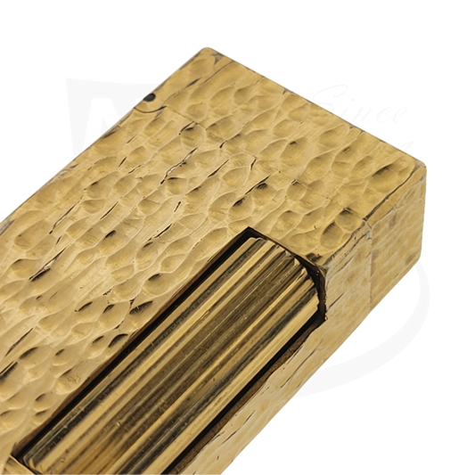 Close up of gold plated Dunhill rollagas showing textured bark pattern.