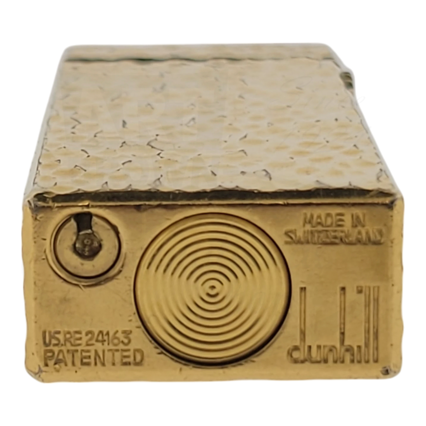 Gold plated Dunhill rollagas with textured bark pattern, seen from the bottom.