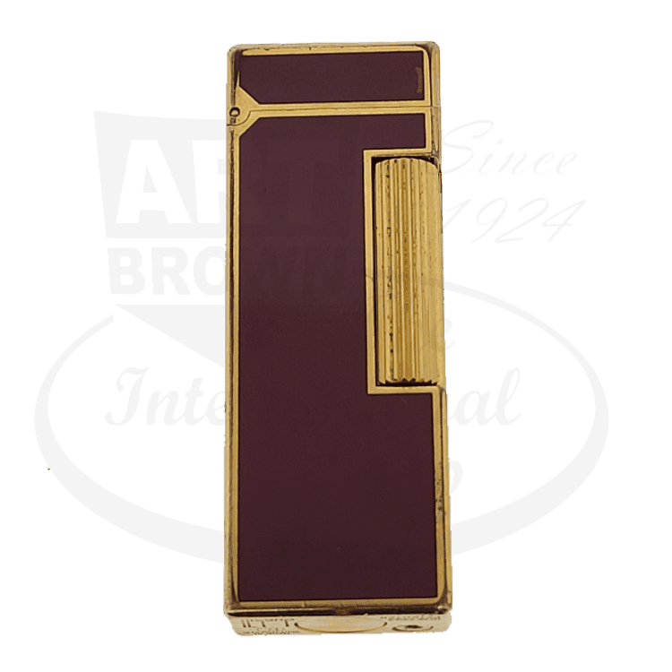 Dunhill Rollagas vintage lighter featuring brass-gold frame with burgundy red lacquer panels, flint ignition system, vertical ribbed texture on side panel