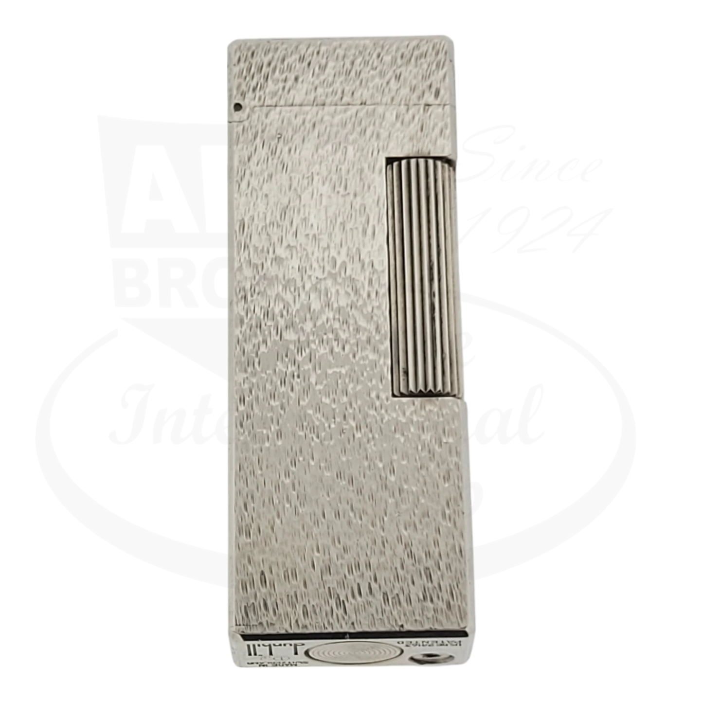 Silver plated Dunhill Rollagas lighter with textured fine bark pattern, seen from the front.