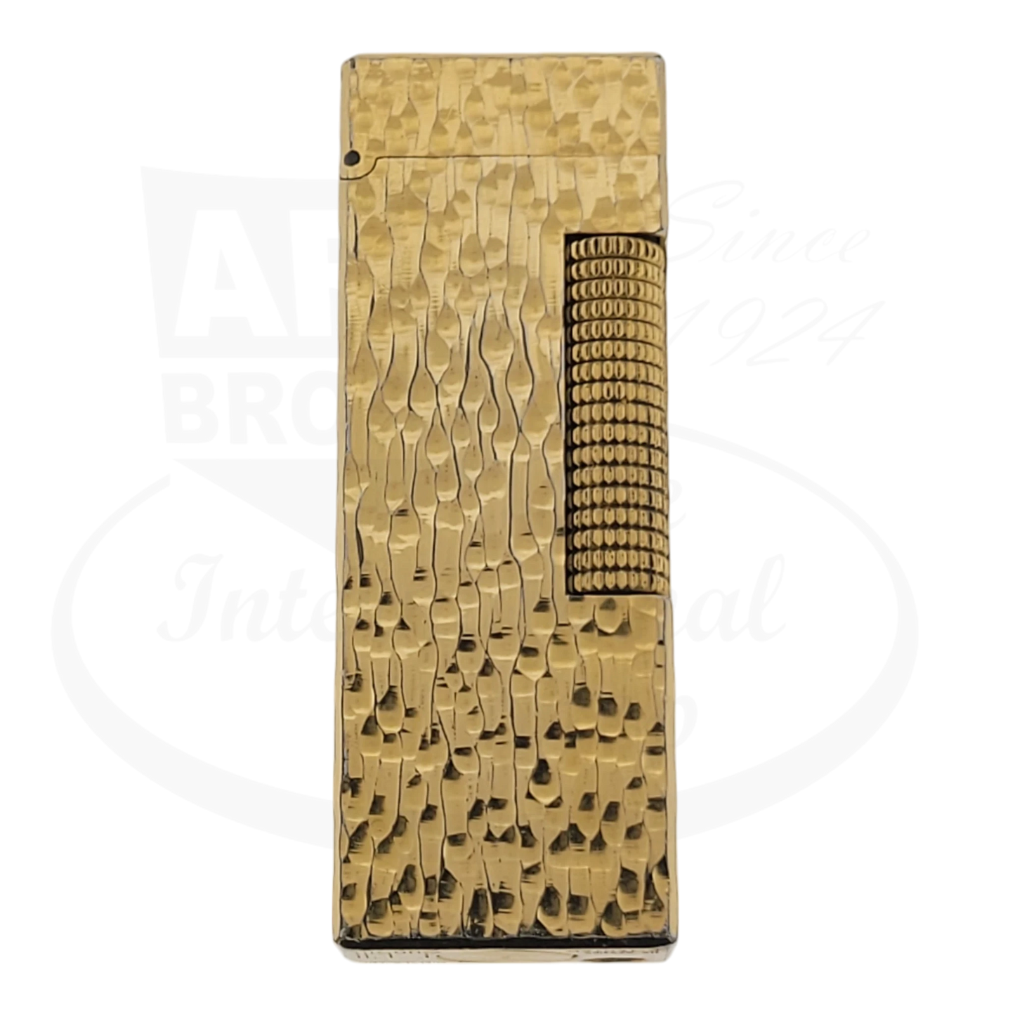 Gold plated Dunhill rollagas lighter with bark pattern, seen from the front.
