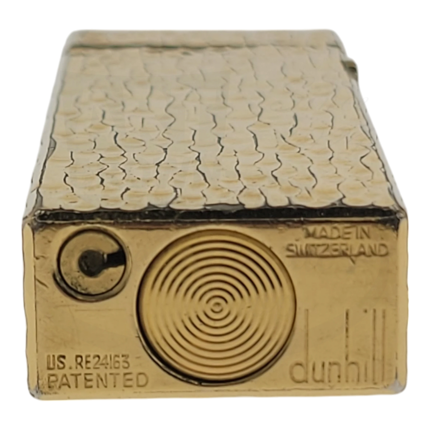 Gold plated Dunhill rollagas lighter with bark pattern, seen from bottom.