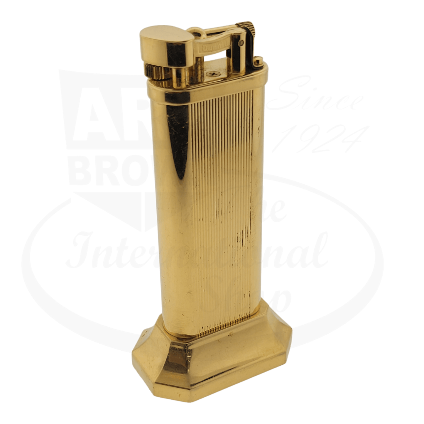 Dunhill unique gold table lighter, seen from an angle.