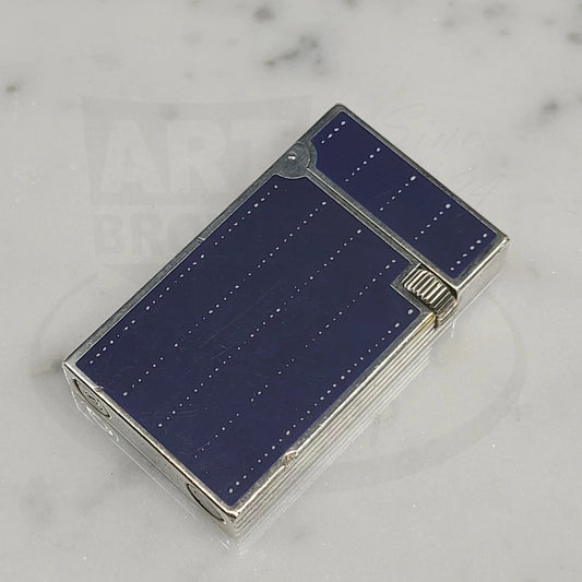 Preowned Vintage S.T. Dupont Line D Fantasies Denim Lacquer & Palladium lighter with blue lacquer, palladium body, and flint ignition.