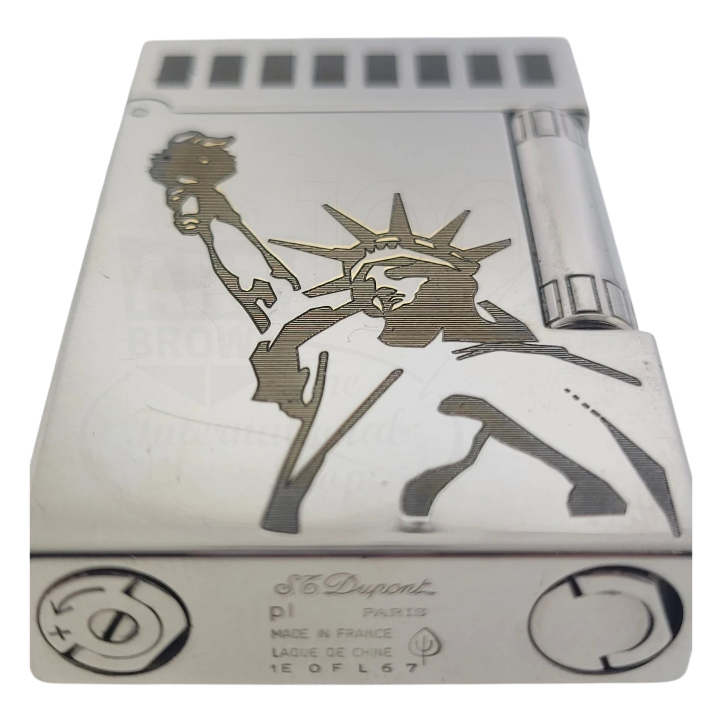S.T. Dupont Ligne 2 lighter with soft flame, polished platinum-plated brass body, and Statue of Liberty engraving detail