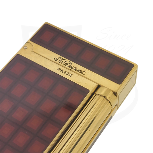 S.T. Dupont Ligne 2 Vertigo V1 016512 gold-plated lighter with red lacquer geometric design, preowned condition