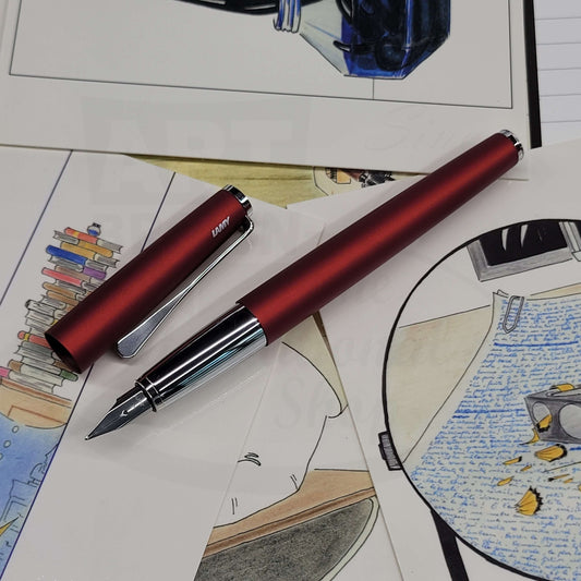 Lamy studio royal red matte finish fountain pen with cap off, showing chrome grip and stainless steel nib.