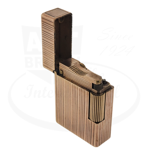 S.T. Dupont Ligne 1 BS Gold lighter, vertical lines, open view from the front discolored.