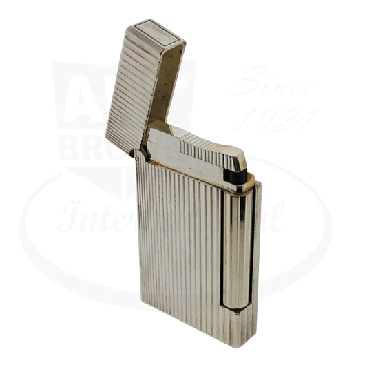 S.T. Dupont Ligne D palladium-plated brass lighter featuring vertical line pattern, shown open at angle displaying silver finish and distinctive ridged texture