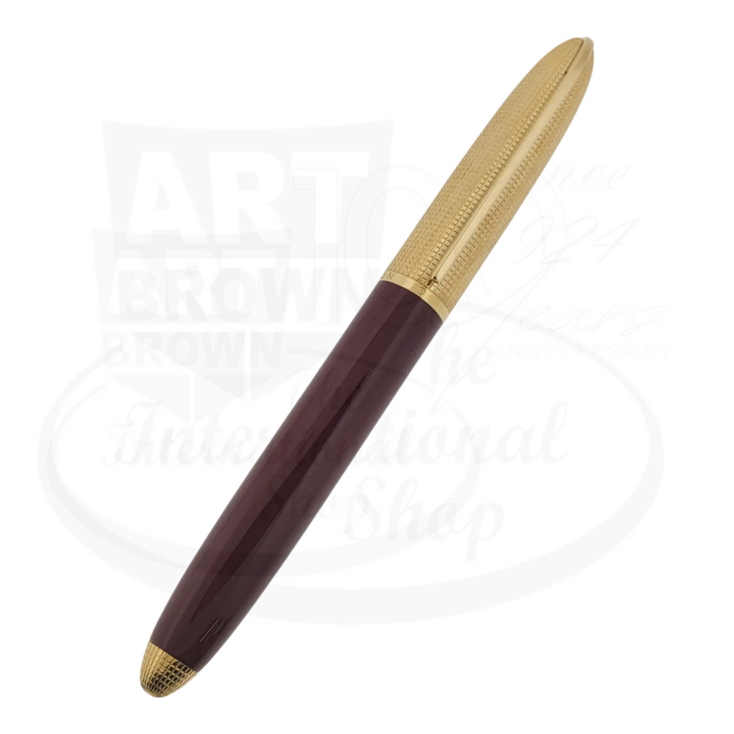 Louis Vuitton Doc Lacquer Rollerball Pen in burgundy lacquer barrel with gold-tone grid-textured cap and trim, featuring tapered design